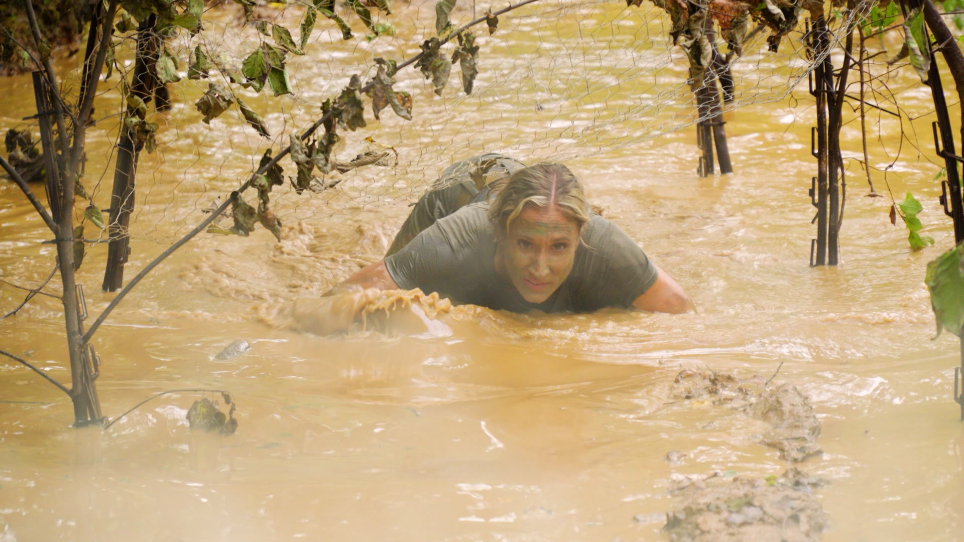 Face Off: The Tactical Decathlon Premieres August 17 on Pursuit Channel 3 A Face Off competitor crawls through a muddy tactical obstacle.
